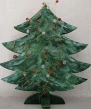 Wood fir tree decorated with beads