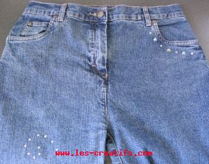 personalizing a pair of jeans with rhinestones